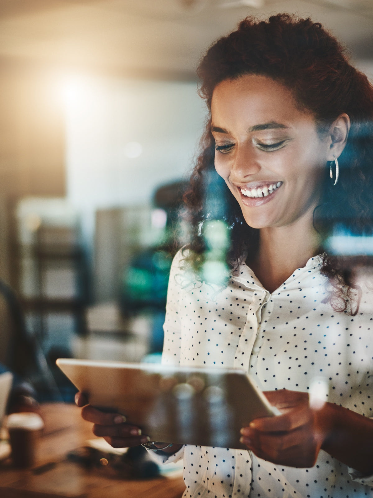 Confident woman using a tablet to explore empowering content